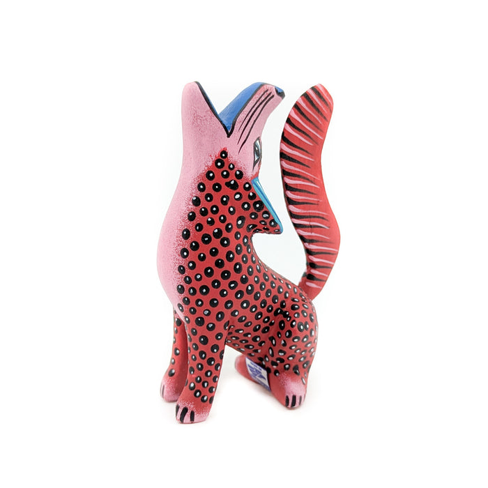 Howling Red and Black Spotted Coyote