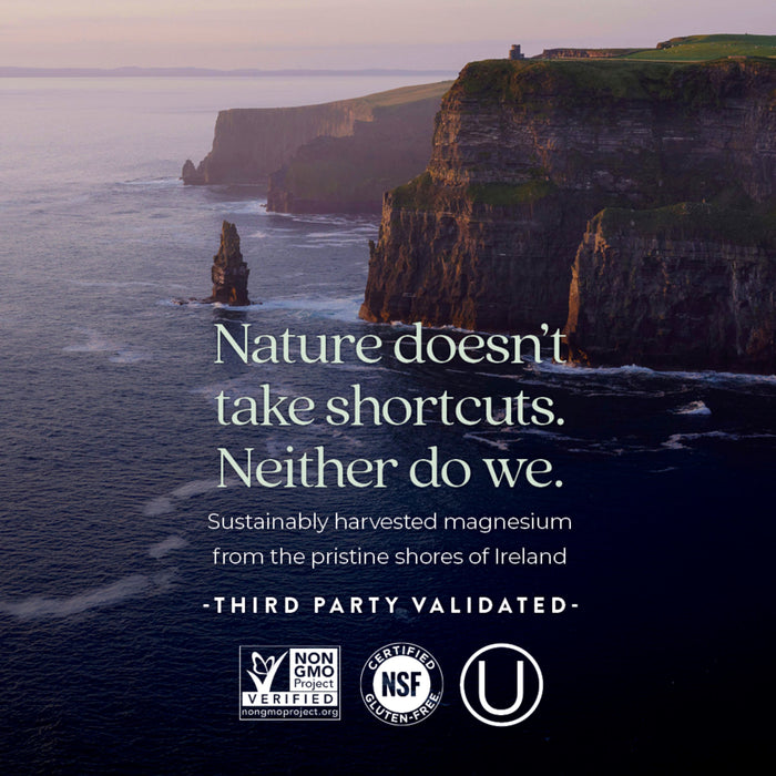 Scenic view of tall cliffs along a coastline at sunset, with text overlay promoting sustainably harvested magnesium from Ireland. Logos for Non-GMO, NSF, and gluten-free certification are displayed.