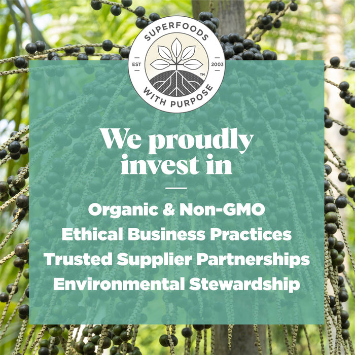 A background of an acai plant with a circular logo displaying Superfoods with Purpose at the top features overlaid text: We proudly invest in Organic & Non-GMO, Navitas Organics Acai Powder, Ethical Business Practices, Trusted Supplier Partnerships, Environmental Stewardship.
