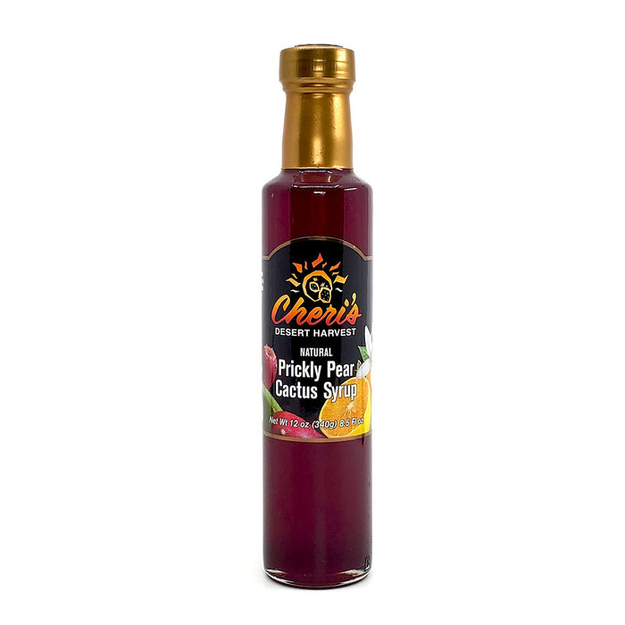 Beautiful deep purple Prickly Pear cactus syrup by Cheri's Desert Harvest in a glass bottle with citrus and opuntia on the label