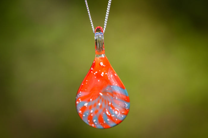 Rising Sun Cremation Jewelry with Cremation Ashes