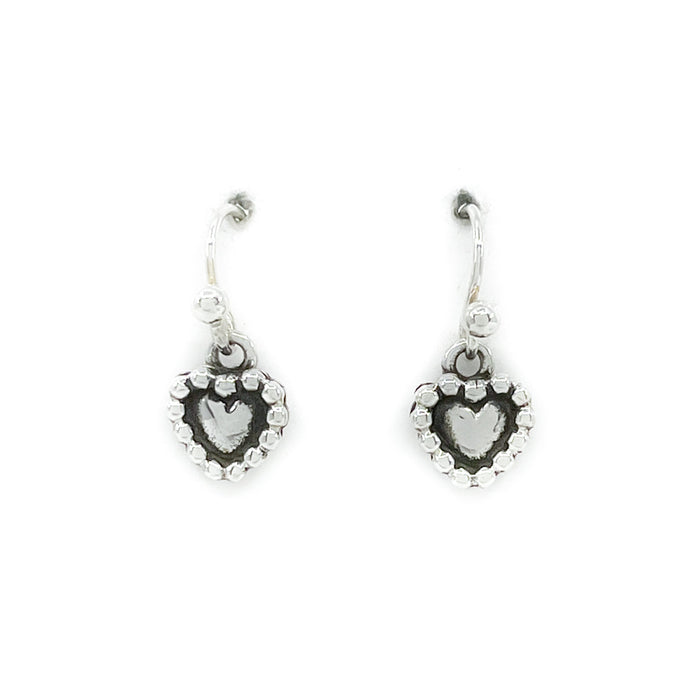 Sterling silver handcrafted heart shaped earrings - very delicate!
Measures approximately .25 by .25 inches, dangles .75 inches from earlobe
Sterling silver wires