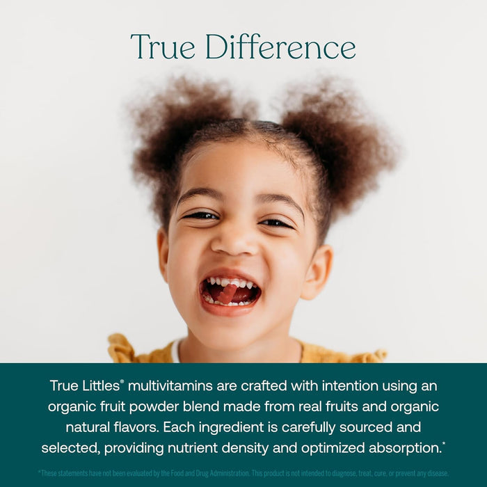 A young, curly-haired child smiles joyfully in a yellow shirt. Text below highlights the benefits of True Grace True Littles Daily Kids Multivitamin Gummies, made with organic fruit powder, natural flavors, and vegan vitamin D3.