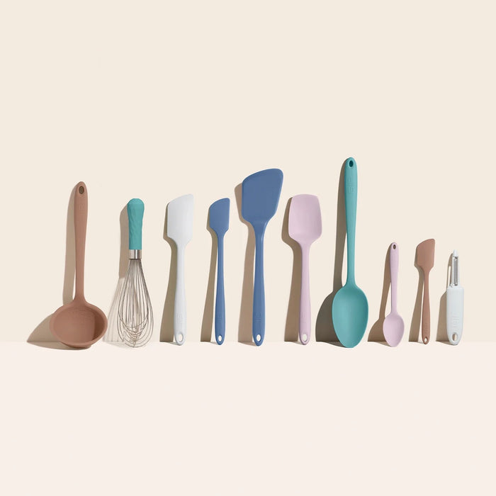 The 10-Piece Best Sellers Kitchen Tool Set by GIR showcases colorful, heat-resistant utensils against a neutral background, including a ladle, whisk, spatulas, and spoons made from premium platinum-cured silicone in brown, teal, blue, and white.