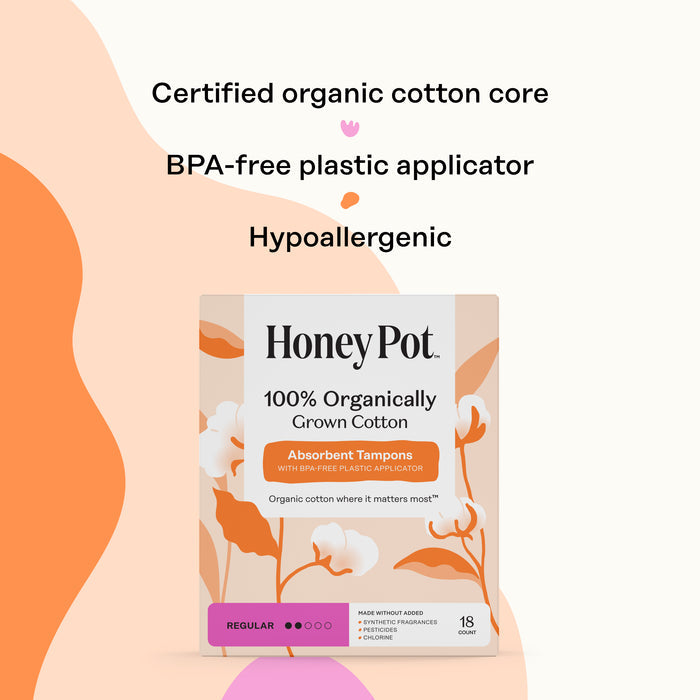 Box of The Honeypot Company 100% Organic Regular Tampons, hypoallergenic and unscented with BPA-free applicator and leak protection. Background includes orange and pink abstract shapes plus product feature highlights.