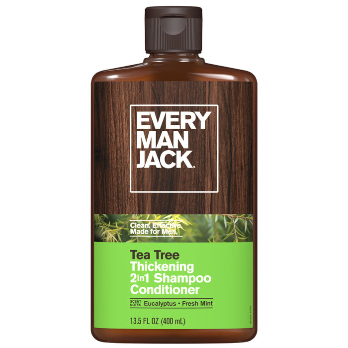 A 13.5 fl oz brown bottle of Every Man Jack 2-in-1 Shampoo and Conditioner for Men, with green and white labeling, enriched with tea tree, eucalyptus, and fresh mint, made from clean ingredients and cruelty-free, shown against a woodgrain background.