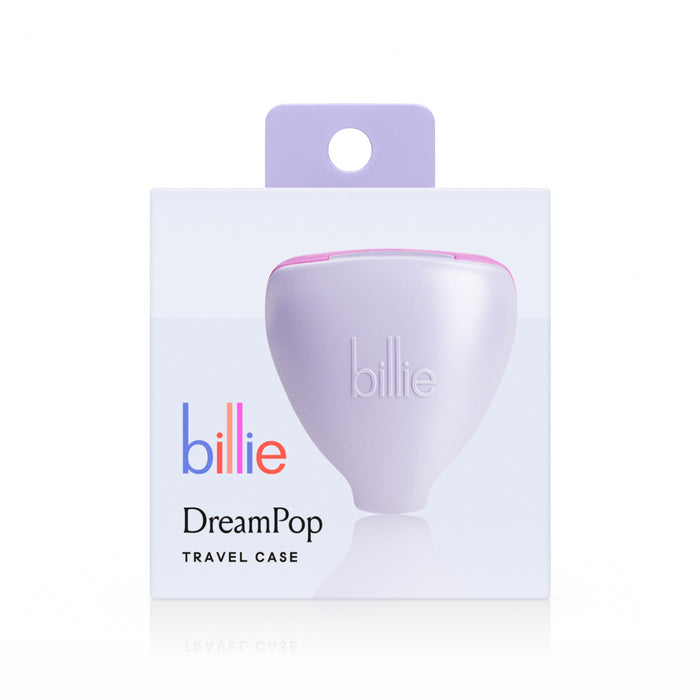 A pastel purple 5-Blade Women’s Razor Travel Case by billie, packaged with billie in colorful letters and DreamPop in black. This case is ideal for storing your razor and includes a lavender hanging tab against a white background.