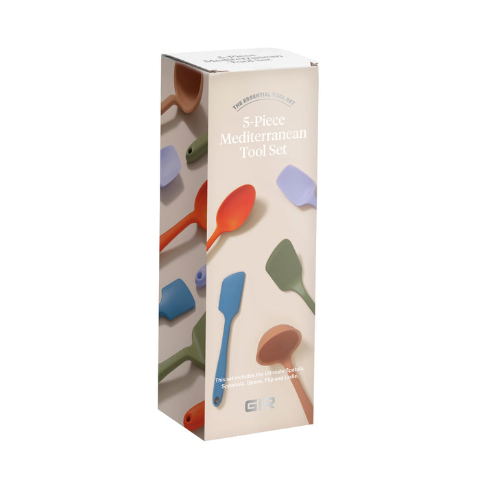 The tall rectangular box of the 5-Piece Ultimate Tool Set by GIR displays vibrant images of heat-resistant silicone cooking tools, such as a spatula and spoon. The multicolored packaging emphasizes these durable, kitchen-ready utensils made from pharmaceutical-grade silicone.