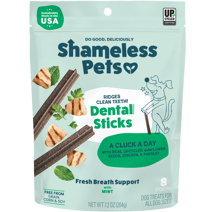 A green bag of Shameless Pets A Cluck A Day Probiotic Dental Stick features minty dental sticks made with real upcycled ingredients like chicken, sunflower seeds, and parsley to help freshen your dog’s breath.