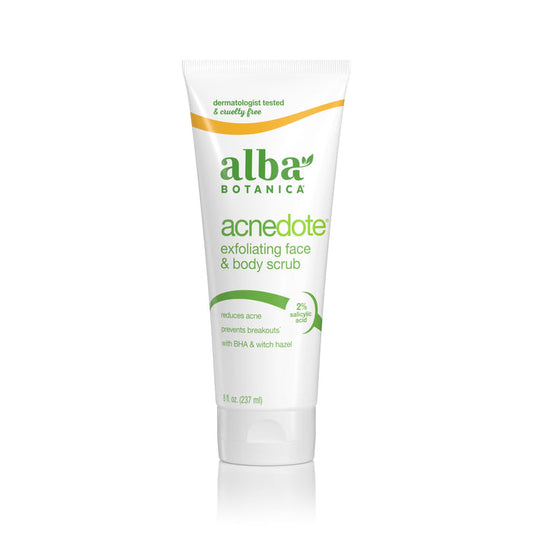 A white tube of Alba Botanica AcneDote Face & Body Scrub with green text, featuring salicylic acid to target breakouts and a yellow curved label that says dermatologist tested and cruelty free.