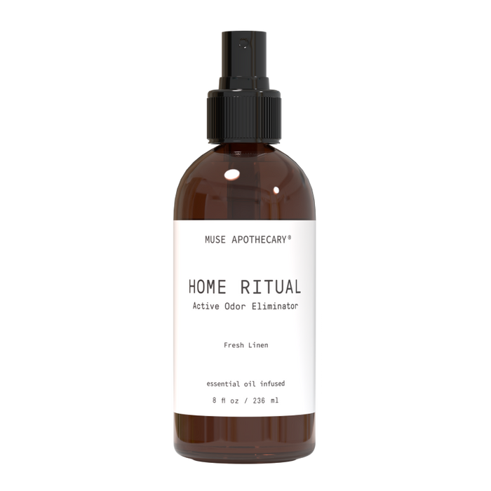 The Muse Apothecary Active Odor Eliminator in a brown 8 fl oz bottle with a black nozzle, features a Fresh Linen scent and essential oils. It neutralizes household odors using Muse Clear technology.
