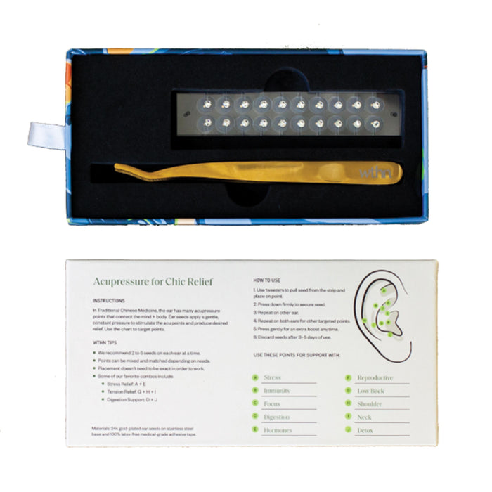 The WTHN Acupressure Crystal Ear Seed Kit includes a gold tool, ear seeds, and an acupressure points chart detailing benefits like pain relief, stress reduction, and sleep improvement. The tool is elegantly positioned on a black foam insert inside a beautifully patterned box.