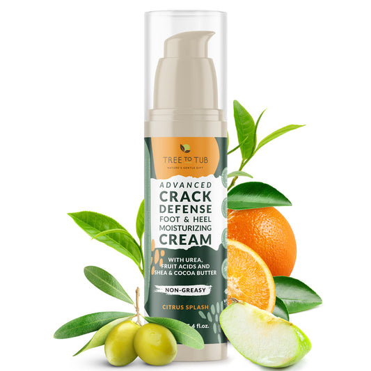 A bottle of Tree To Tub Advanced Crack Defense Deep Moisturizing Heel & Foot Cream, non-greasy with a citrus splash scent, is showcased with green leaves, sliced lime, orange, and olives to emphasize its natural ingredients for dry cracked heels.