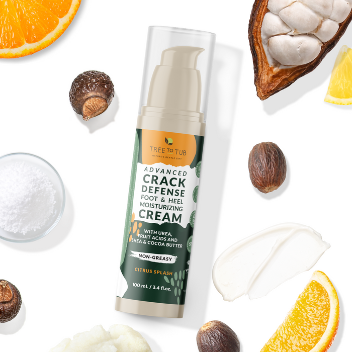 Image of the Tree To Tub Advanced Crack Defense Deep Moisturizing Heel & Foot Cream for dry, cracked heels. This rich cream, enhanced with urea, shea, fruit acids, and cocoa butter, is displayed with vibrant oranges, coconuts, shea nuts, and cocoa against a pure white backdrop.