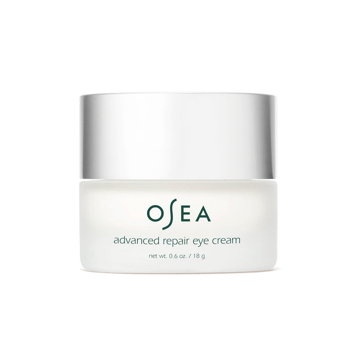 The OSEA Advanced Repair Eye Cream comes in a white jar with a metallic lid, containing 0.6 oz / 18 g of an anti-aging formula designed to reduce puffiness and rejuvenate the eyes.