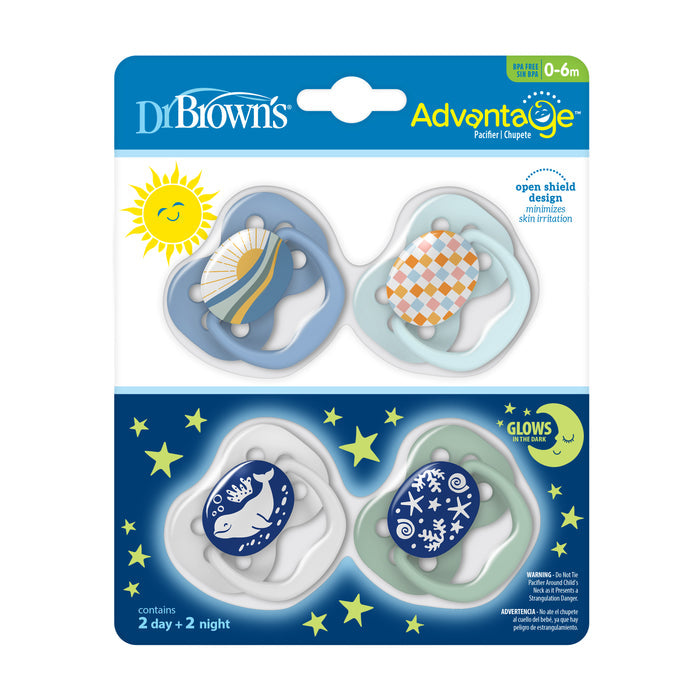 Dr. Browns Advantage Glow-in-the-Dark Baby Pacifier set for 0-6 months includes four stage 1 pacifiers, featuring two day and two glowing night options, all with a fully symmetrical soother design and soft silicone bulb, adorned in playful blue, green, and orange patterns.