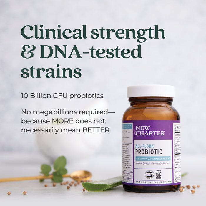 A bottle of New Chapter All-Flora™ Probiotic for Advanced Digestion & Complete Gut Health rests on a white surface with a plant stem, highlighting 10 Billion CFU, clinical strength, and DNA-tested strains for gut support.