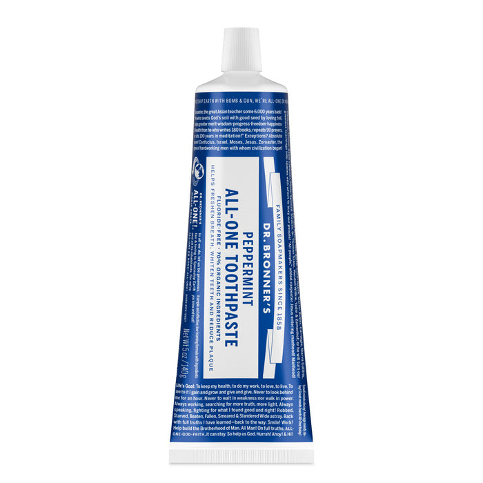 A blue and white tube of Dr. Bronners All-One Toothpaste stands upright with the cap on, displaying its label. This natural toothpaste is fluoride-free and features the Peppermint variety branding.