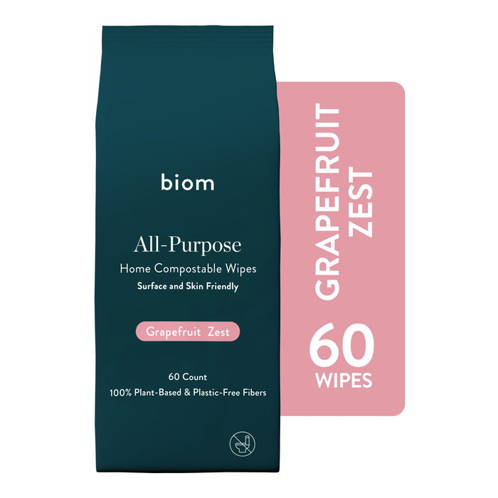 A teal package of Biom All-Purpose Wipe Refills in Grapefruit Zest scent, made with 100% plant-based, plastic-free fibers. Contains 60 wipes and is shown against a pink background.