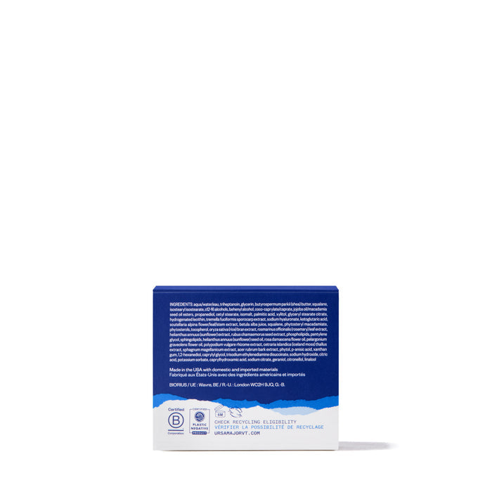 A blue and white rectangular Ursa Major Alpine Rich Cream box with white text on the back, featuring skin barrier support details, ingredients, and recycling info, displayed against a plain white background.