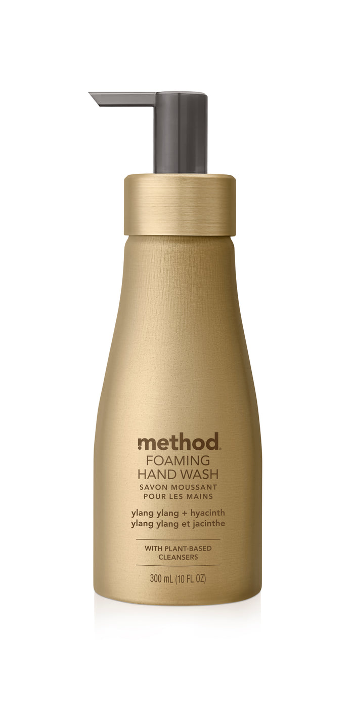 The method Aluminum Foaming Hand Soap comes in an elegant gold 300 ml (10 fl oz) bottle with a gray pump. The label reads ylang ylang + hyacinth, highlighting its plant-based cleansers, making it fragrance-friendly and ideal for sensitive skin.