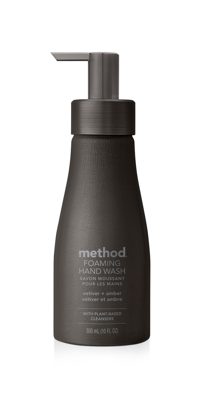 A 300 ml bottle of method Aluminum Foaming Hand Soap in dark olive, featuring a pump dispenser. Its scented with vetiver and amber, contains plant-based cleansers, and comes in refillable bottles—ideal for eco-conscious consumers.