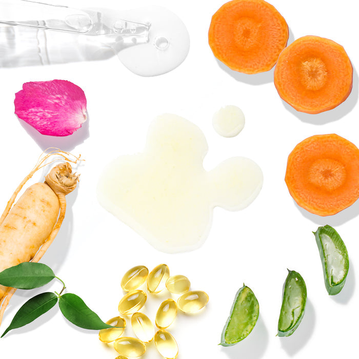 A variety of skincare ingredients on a white background feature carrot slices, aloe vera, a root, pink rose petals, green leaves, gel capsules, and a clear drop of Tree To Tubs Anti Aging Green Tea, Hyaluronic & Retinol Serum for Face with a beige cream splash—ideal for sensitive skin routines.