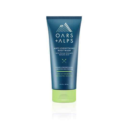 A blue and green 8 fl oz tube of Oars + Alps Anti-Everything Body Wash with Salicylic Acid, designed to clear and prevent acne while smoothing skin texture—ideal for bacne treatment. The tube stands upright on a white background.