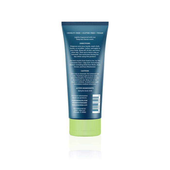 A blue tube with a green cap displays the back label of Oars + Alps Anti-Everything Body Wash, detailing directions, ingredients, and contact info. Its cruelty-free, gluten-free, vegan, and uses Salicylic Acid to treat acne and bacne.