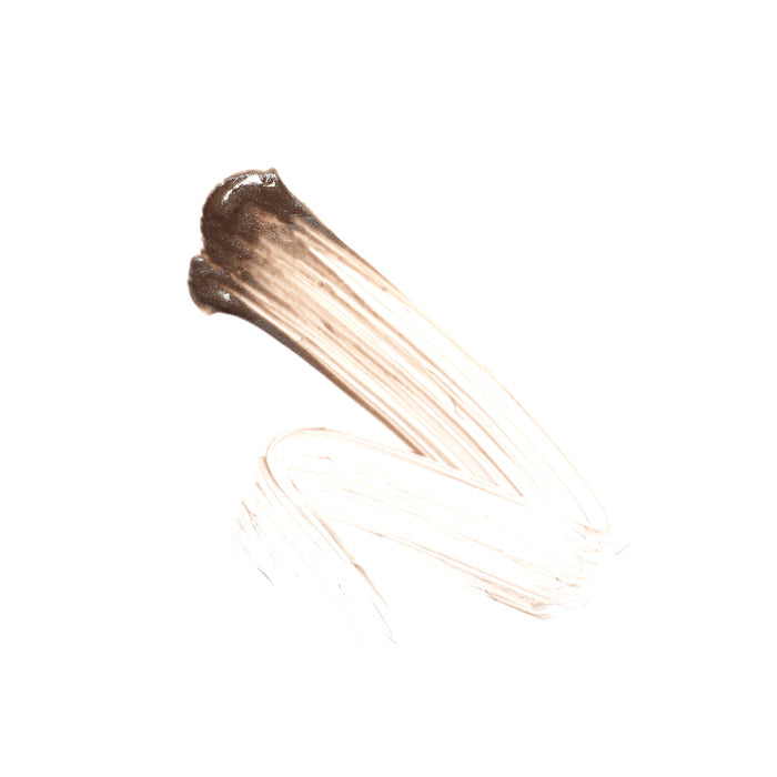 The Argan Brow Hero by Ere Perez is reminiscent of brows shaped with tinted gel, featuring a smooth texture and a blend of brown and beige on a white background from dark to light tones.