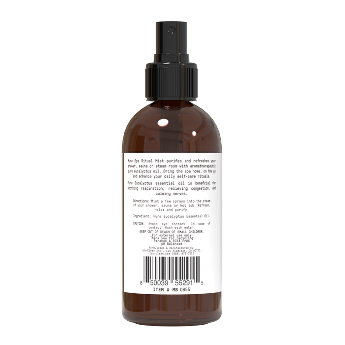The Aromatherapy Shower Mist by Muse Apothecary is a brown spray bottle with a black nozzle, ideal for self-care rituals. Featuring eucalyptus essential oil, the label provides usage instructions and ingredients, with a barcode at the bottom.