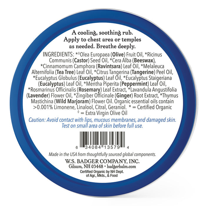 A round container with a white label promoting Badger Balms Aromatic Chest Rub, an herbal balm with essential oils like olive, jojoba, and eucalyptus. Made by W.S. Badger Company, Inc., it cautions against use on damaged skin.