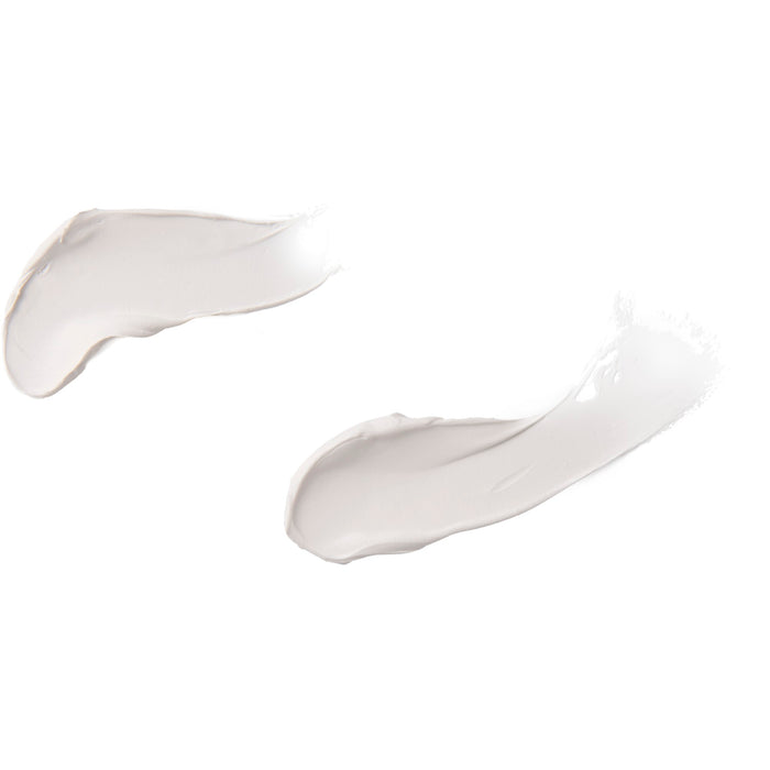 On a white background, two smears of cream reveal a smooth, slightly glossy texture, suggesting Burts Bees Baby Bee Diaper Rash Ointment.