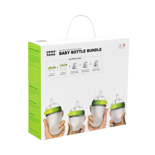 The Baby Bottle Gift Set by Comotomo features bottles resembling breastfeeding to minimize colic risk. The white packaging with green accents displays four bottles with green tops and handy handles.