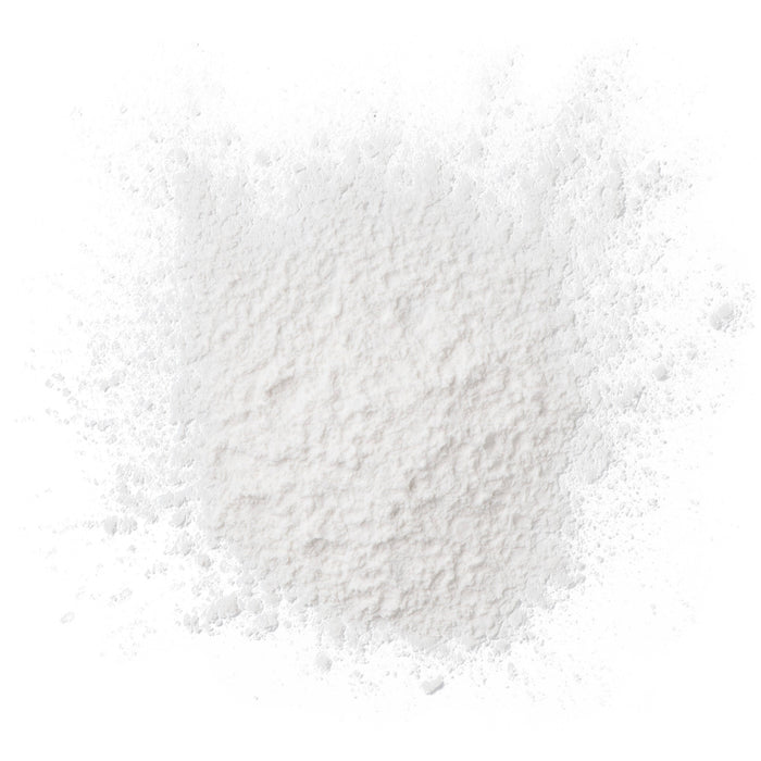 A delicate layer of Burts Bees Baby™ Dusting Powder, which is talc-free, spreads elegantly across the smooth surface with a texture reminiscent of fine flour.