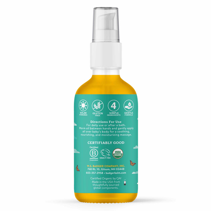 Badger Balm Baby Oil has a green label with Solar Powered, Gluten-Free, Gentle Moisturizer, and USDA Organic symbols. Made with 4 simple organic ingredients, the back label provides use directions and company info.
