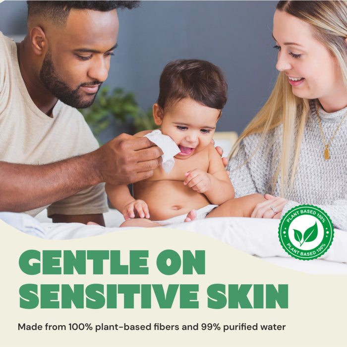 A father gently wipes his baby’s mouth with DYPER Baby Wipes for Sensitive Skin as the mother smiles beside them. Text: “Gentle on sensitive skin. Made from 100% plant-based fibers and 99% purified water.” Plant-based icon shown.