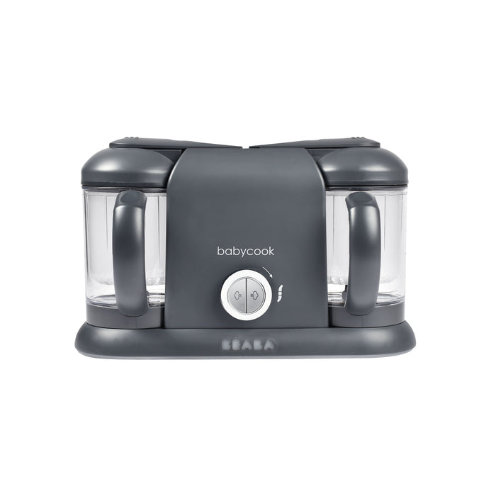 Front view of the BEABA Babycook Duo Baby Food Maker in gray, featuring dual containers with handles. Ideal for homemade baby food, it allows convenient one-handed operation via a central control knob, with branding below.