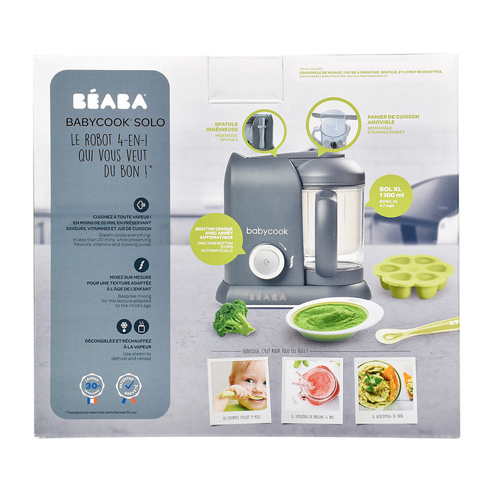 Packaging of the BEABA Babycook Solo in gray shows its features: a food processor, steam cooking basket, blender, and reheating options. It includes text on product capabilities and images of homemade pureed baby food.