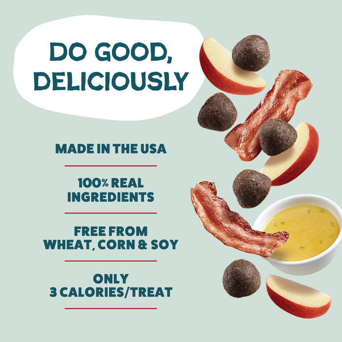 An ad showcases Shameless Pets Bacon Hits Different Bone Broth Training Treats with sliced apples, bacon, and yellow sauce. Text: “Do Good, Deliciously,” made in the USA with 100% real ingredients, no wheat/corn/soy, just 3 calories each.