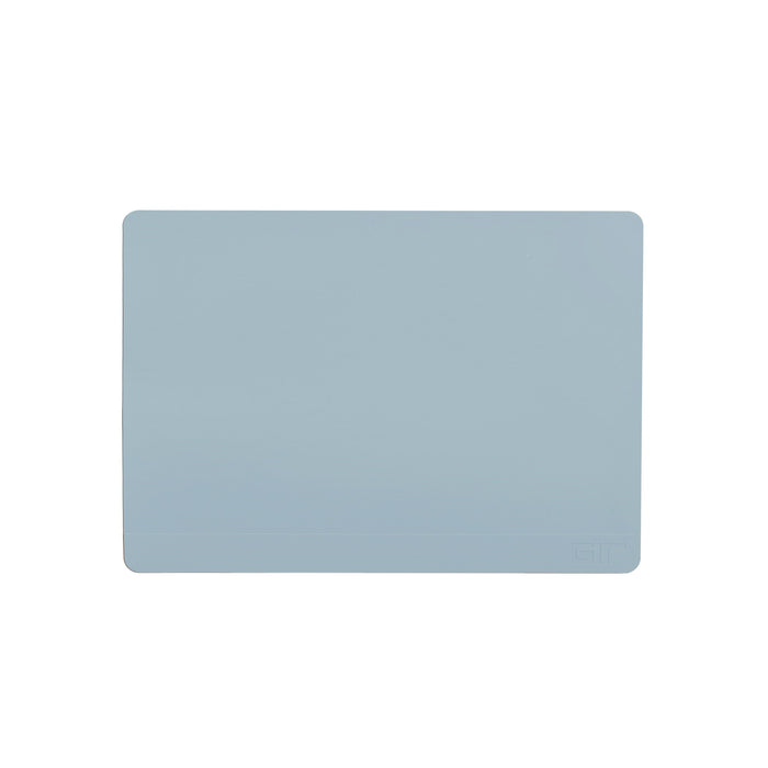 The GIR Baking Mat is a light blue, rectangular silicone mat with rounded corners. Its eco-friendly, plain, and reusable, featuring a discreet logo in the bottom right corner.