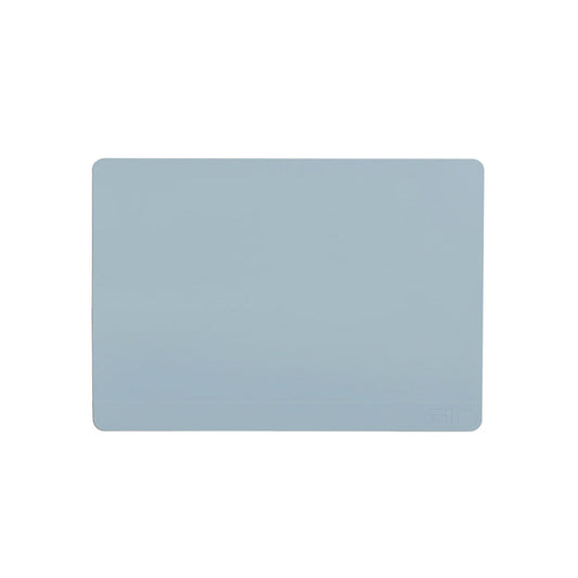The GIR Baking Mat is a light blue, rectangular silicone mat with rounded corners. Its eco-friendly, plain, and reusable, featuring a discreet logo in the bottom right corner.