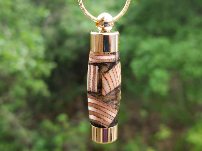 Baltic wood keepsake pendant in resin with gold cap and chain