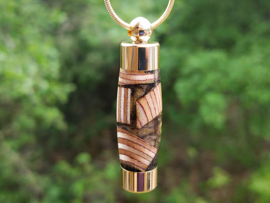 Baltic wood keepsake pendant in resin with gold cap and chain