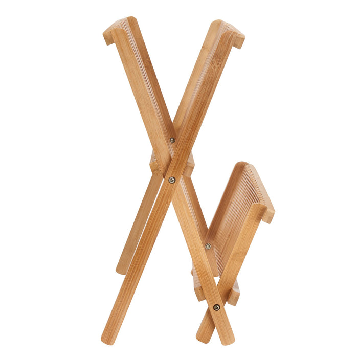 The iDesign Bamboo Folding Collapsible Dish Drying Rack showcases a unique crossed-leg structure when partially opened. Its natural bamboo grain enhances aesthetics, and its lightweight design makes it easily portable for holding various items.