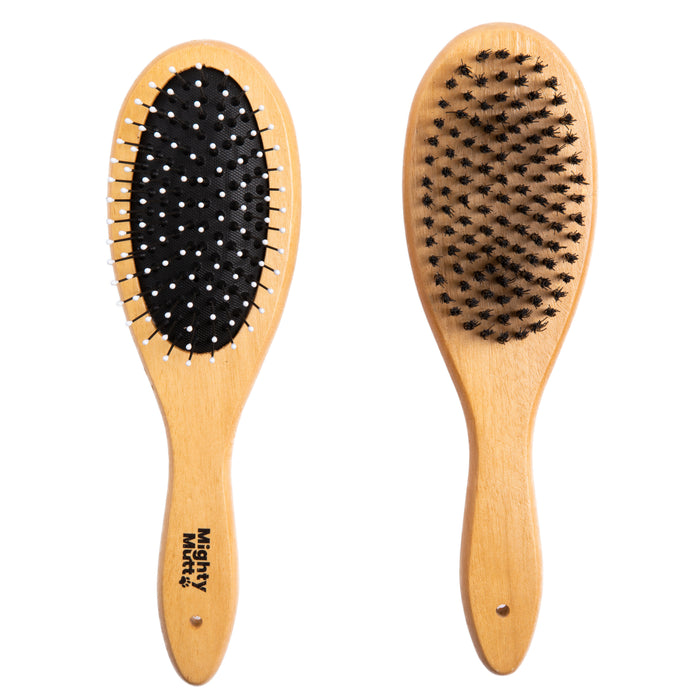 Two Mighty Mutt wooden hairbrushes are displayed: the left features bamboo construction with silver-tipped bristles on a black base, while the right has dense, soft bristles for a shiny coat. Both have handle holes for hanging.