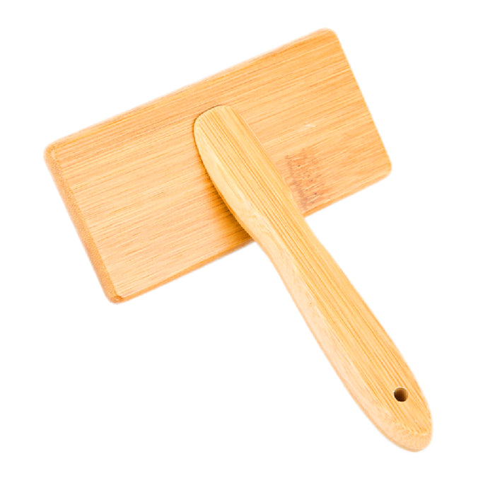 The Bamboo Grooming Brush for Pets by Mighty Mutt features a slicker brush design with smooth edges and an ergonomic handle, made from eco-friendly bamboo. It includes a small hole at the end of the handle for convenient hanging.