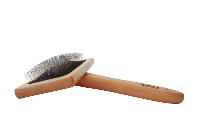 The Mighty Mutt Bamboo Grooming Brush for Pets is an eco-friendly slicker brush with a wooden handle and fine metal bristles, ideal for detangling and removing loose fur. Its ergonomic design features a slight angle for comfortable use by both you and your pet.