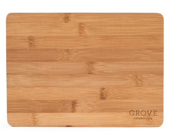 The Grove Co. Bamboo Prep Board features a smooth surface with a striking natural wood grain pattern and the Grove Co. logo in the lower right corner. Made from sustainable bamboo, it offers naturally antibacterial properties for your kitchen needs.