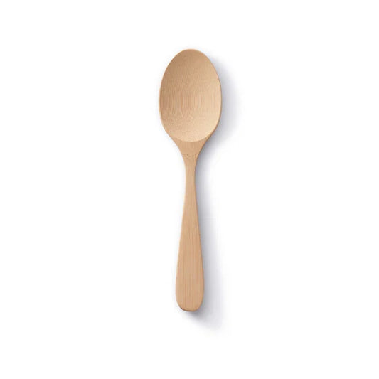 The Bambu Bamboo Serving Spoon is an eco-friendly kitchen utensil with a rounded bowl and flat handle, shown against a plain white background with a soft shadow on the right.